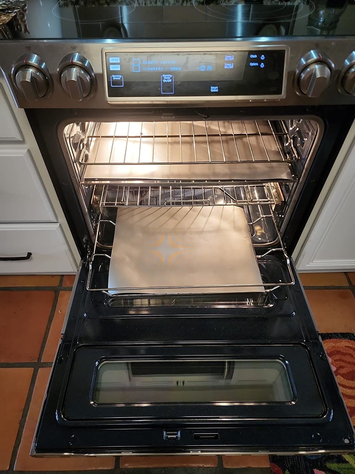 Reviewer&#x27;s photo of the oven liners in use inside an oven