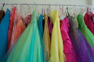 Rack of various colorful prom dresses