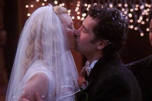 Phoebe Buffay and Mike Hannigan from Friends share a wedding kiss