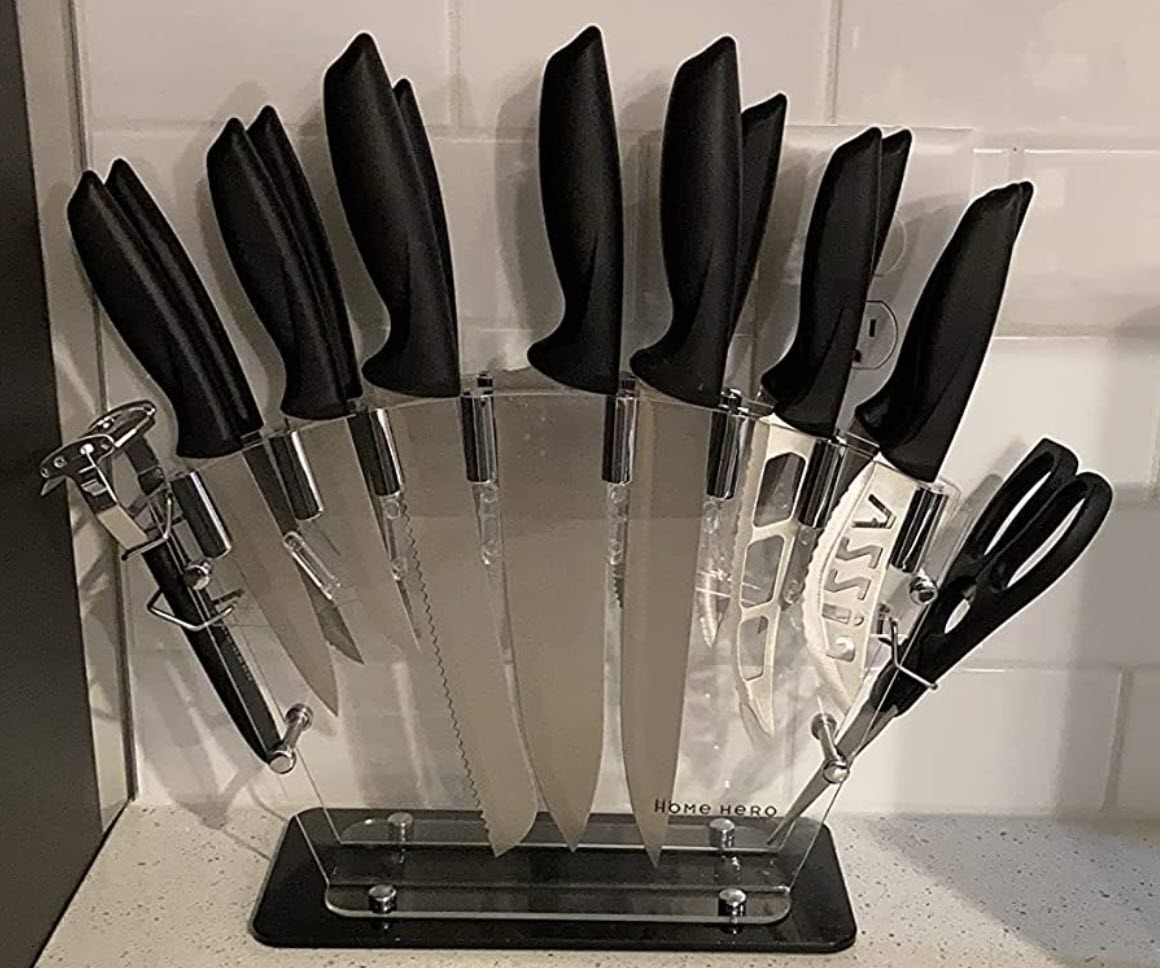 A knife block set with various sizes of knives and a pair of scissors