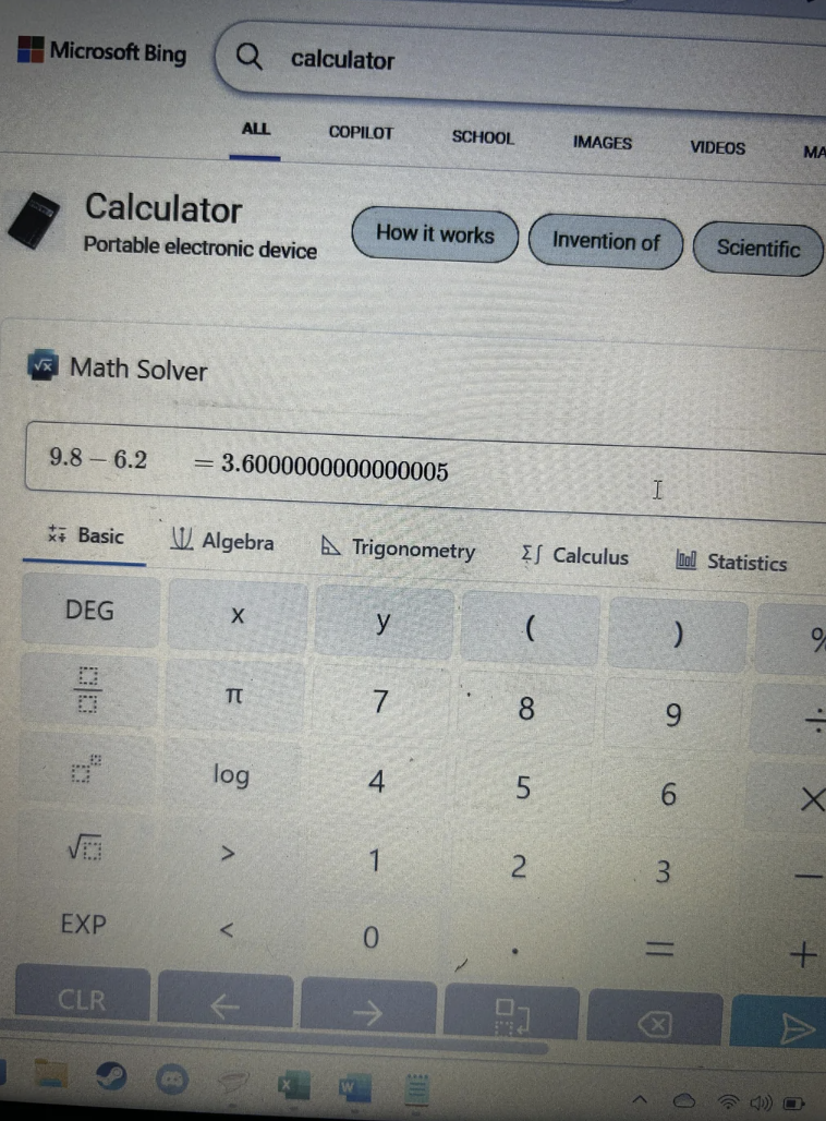 On-screen calculator with an equation solved, buttons for various math functions visible