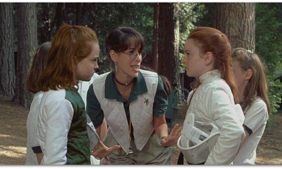 Camp counselor and children from &quot;The Parent Trap&quot; in a discussion amidst trees