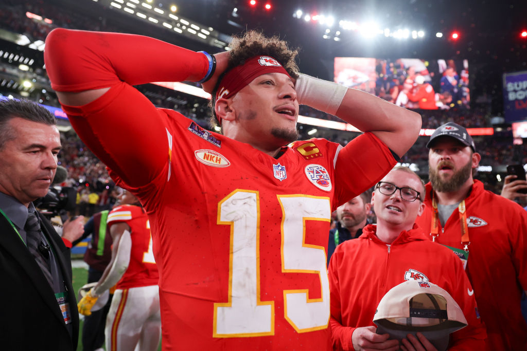 Patrick Mahomes in a football uniform, celebrating on the field with a cap in hand