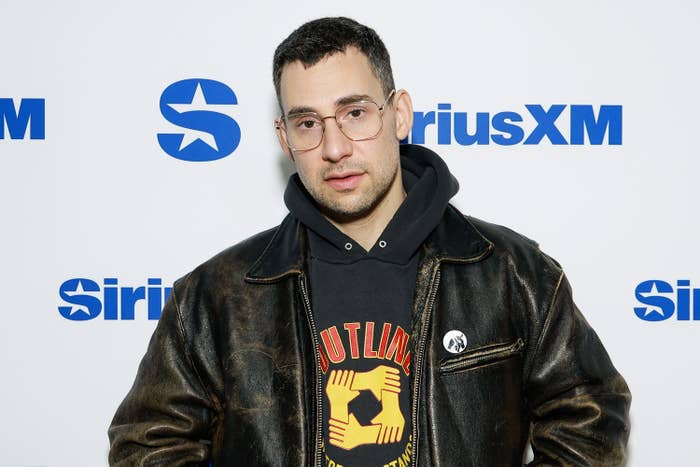 Jack in a leather jacket over a graphic hoodie, standing before SiriusXM backdrop