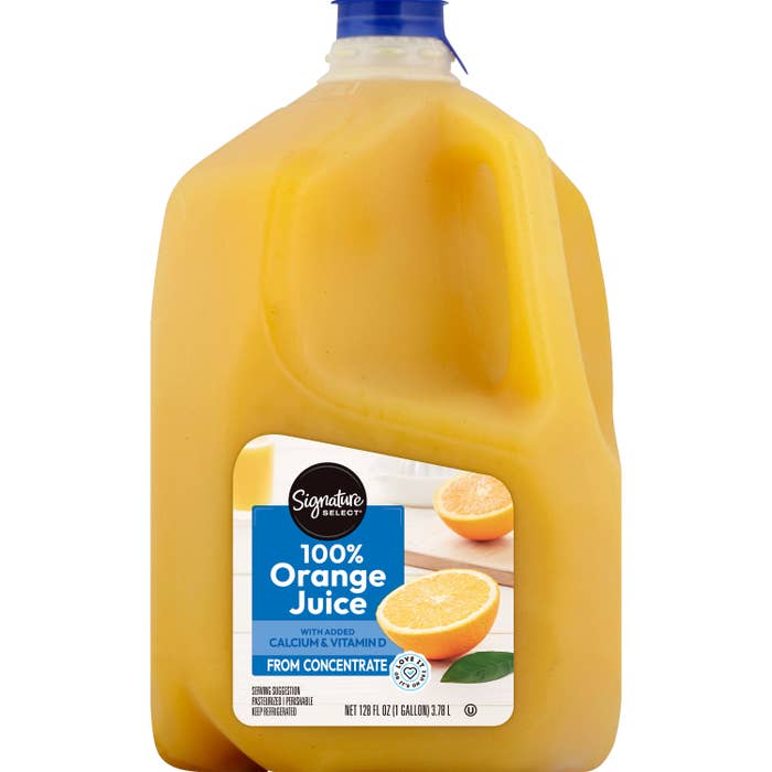 Plastic jug of Signature Select Orange Juice on a white background