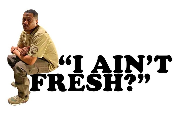 Man squatting with arms crossed, text reads "I AIN'T FRESH?"