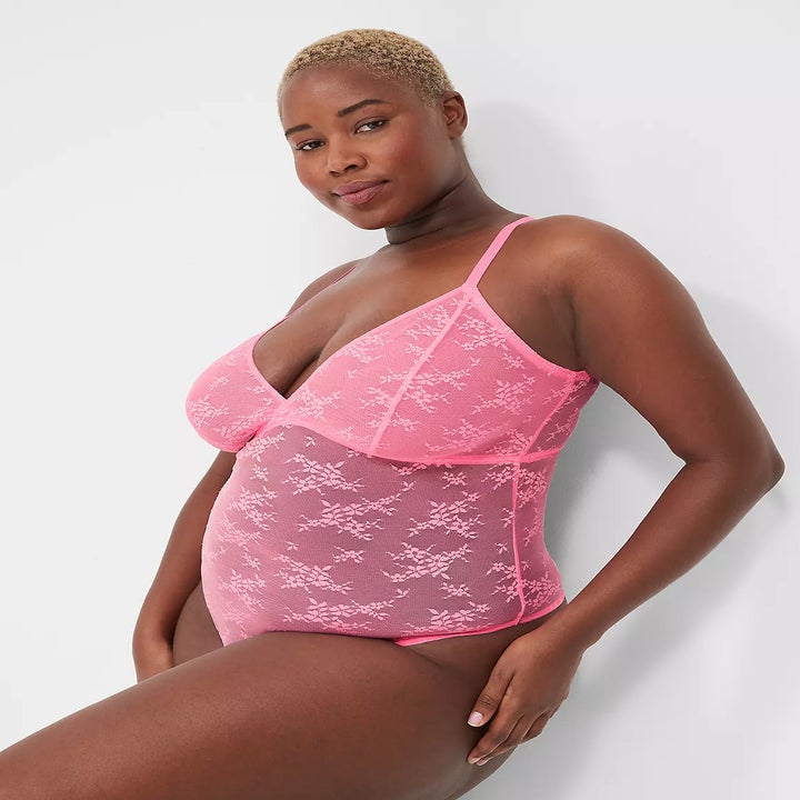 Model wears pink lace bodysuit