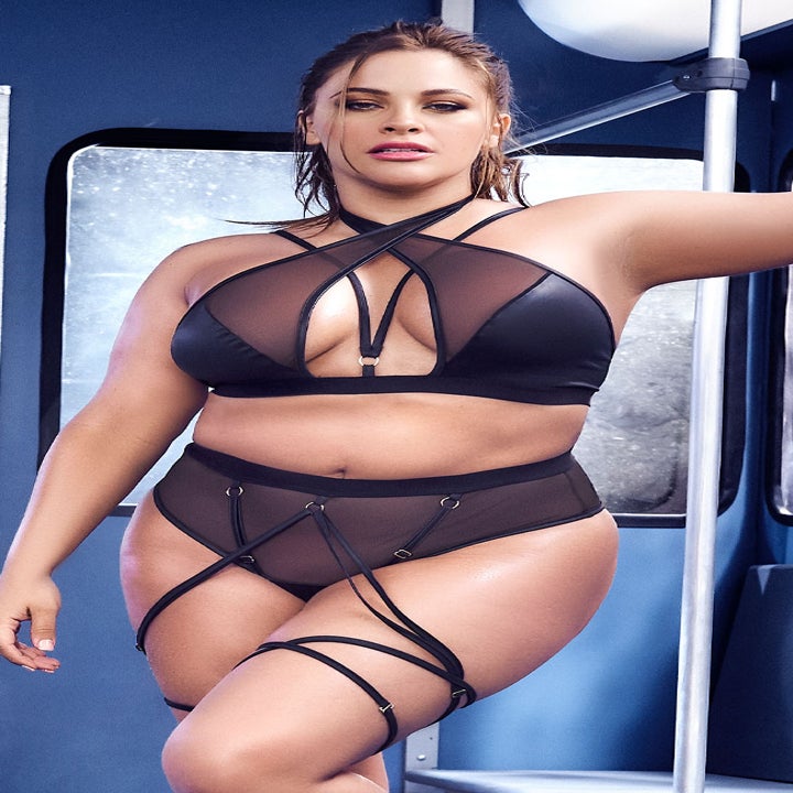 Plus size model in black strappy bodysuit