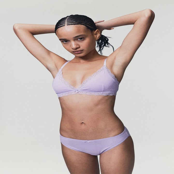 Person in a lilac lingerie set