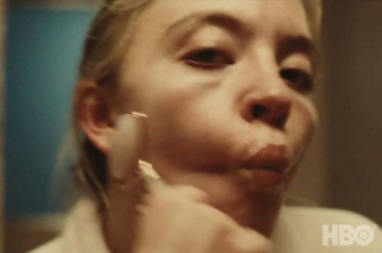 Cassie from Euphoria using a rose quartz roller on her face