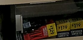 Handwritten sign on a chair stating &#x27;We Do Not Sit At The Register This Is Dollar General Not Aldi&#x27; indicating seating not allowed