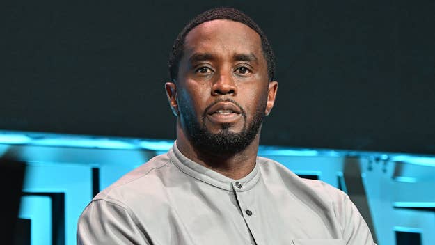 Sean Combs wearing a stylish buttoned shirt at a music event