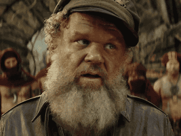 Man with a beard appearing surprised or confused