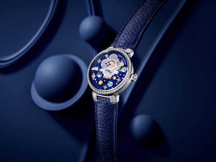 Luxury watch with moon phase, stars, and leather strap, encrusted with diamonds