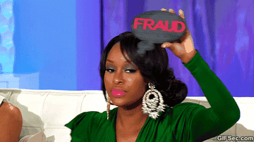 Woman holds clutch with "FRAUD" on it, looking unimpressed