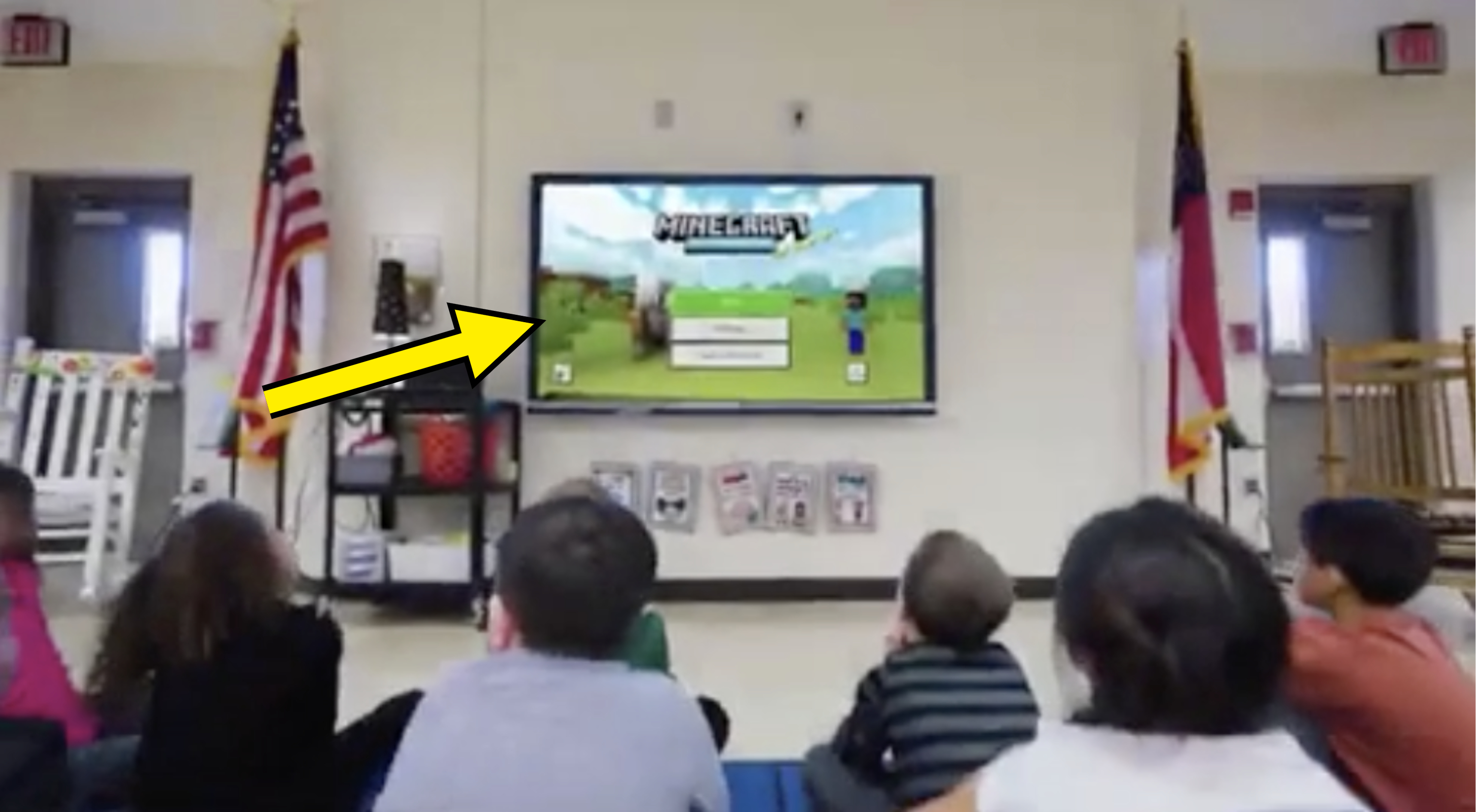People at a seminar with a Minecraft presentation on the screen, indicating gaming in education or work