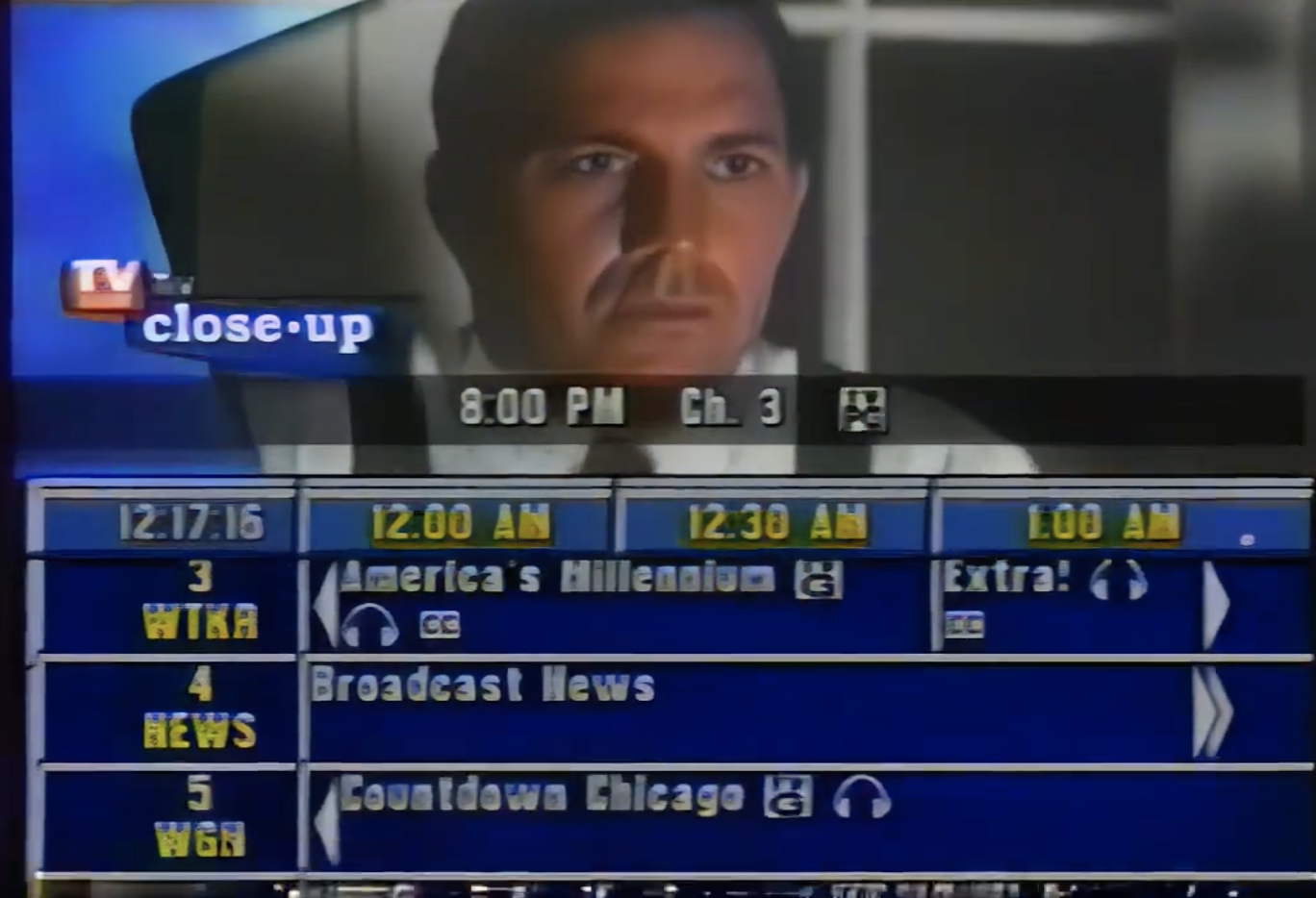 TV screen showing a program guide with broadcast channels and times, and a close-up of a man from a movie