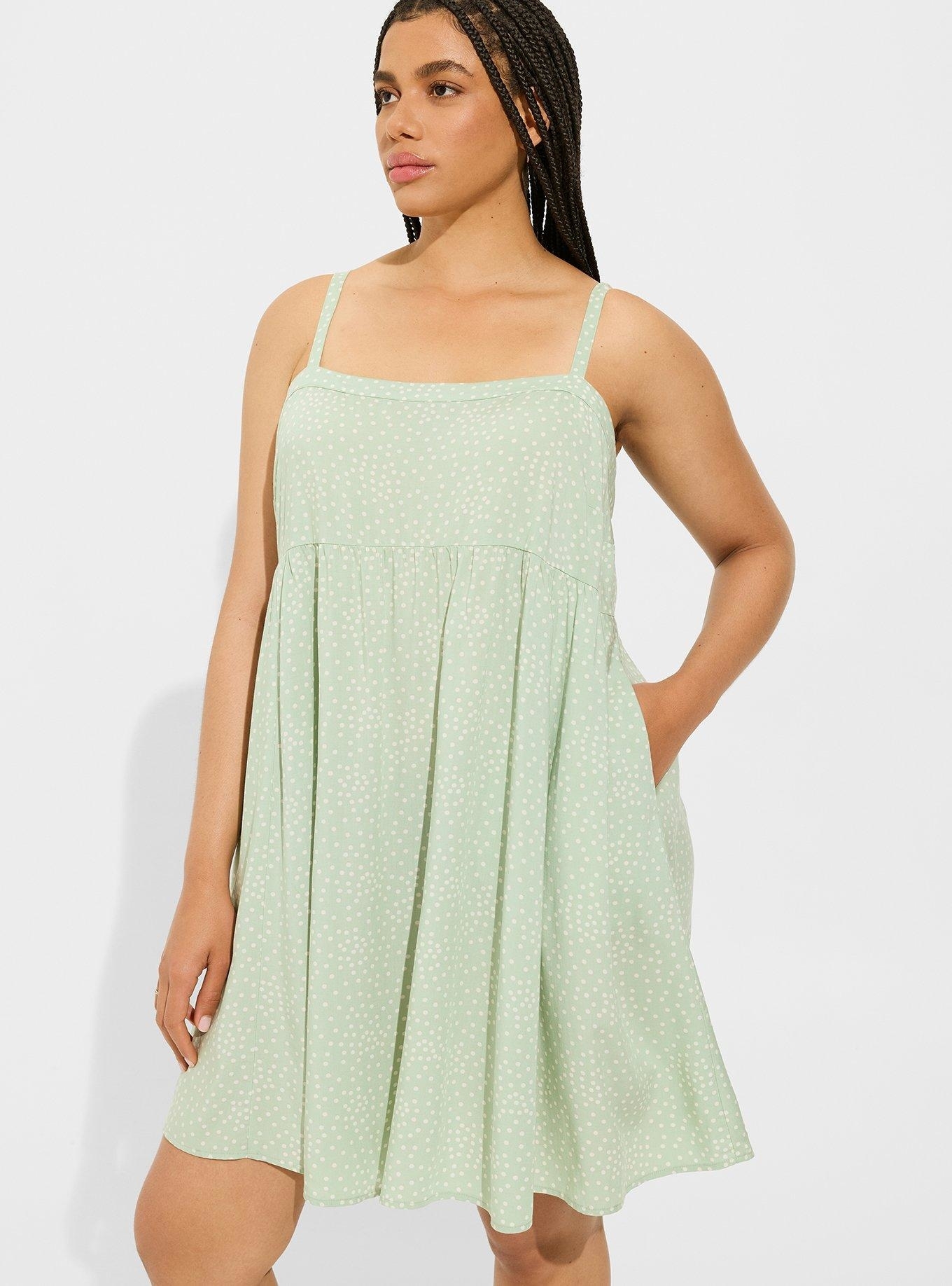Model wearing the green dot dress