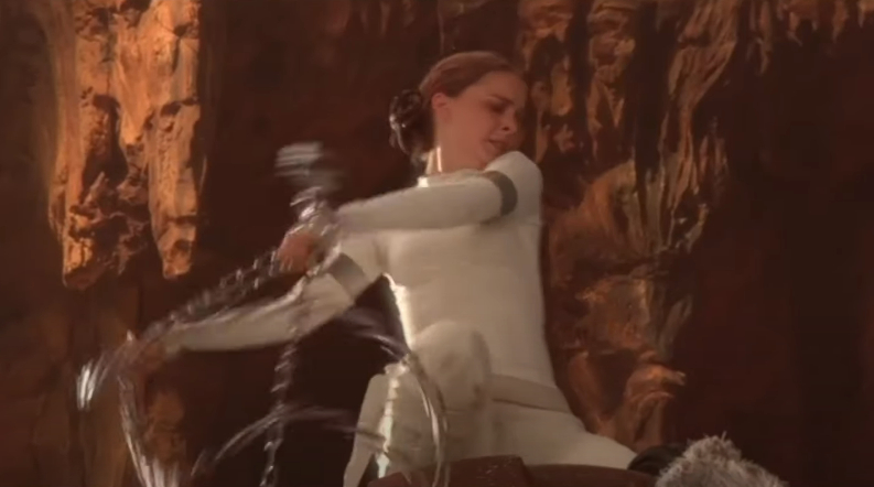 Padme Amidala in white attire engages in combat on Geonosis