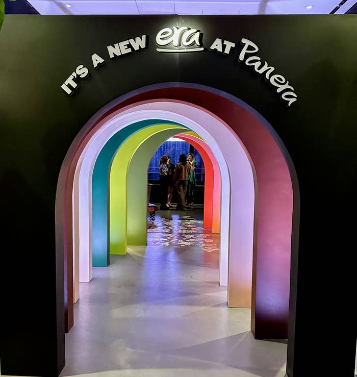 Entrance to Panera featuring a multilayered archway with &quot;It&#x27;s a New Era at Panera&quot; text
