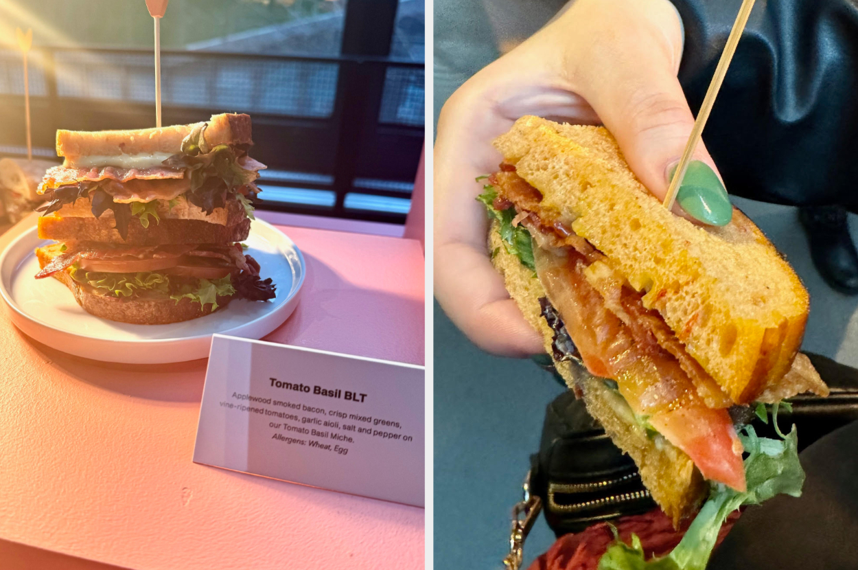 A sandwich on a plate next to a description card, and a hand holding a half-eaten sandwich