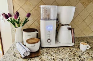 a reviewer's attractive white coffee maker on a counter