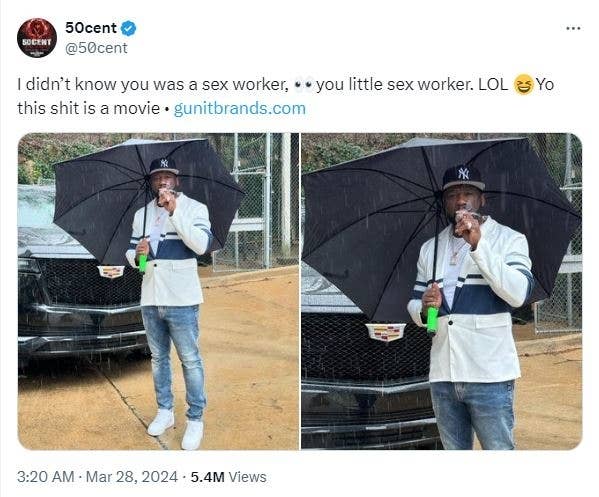 50 Cent in a casual ensemble holding a green bottle and an umbrella, tweeting with humor about a movie and a sex worker