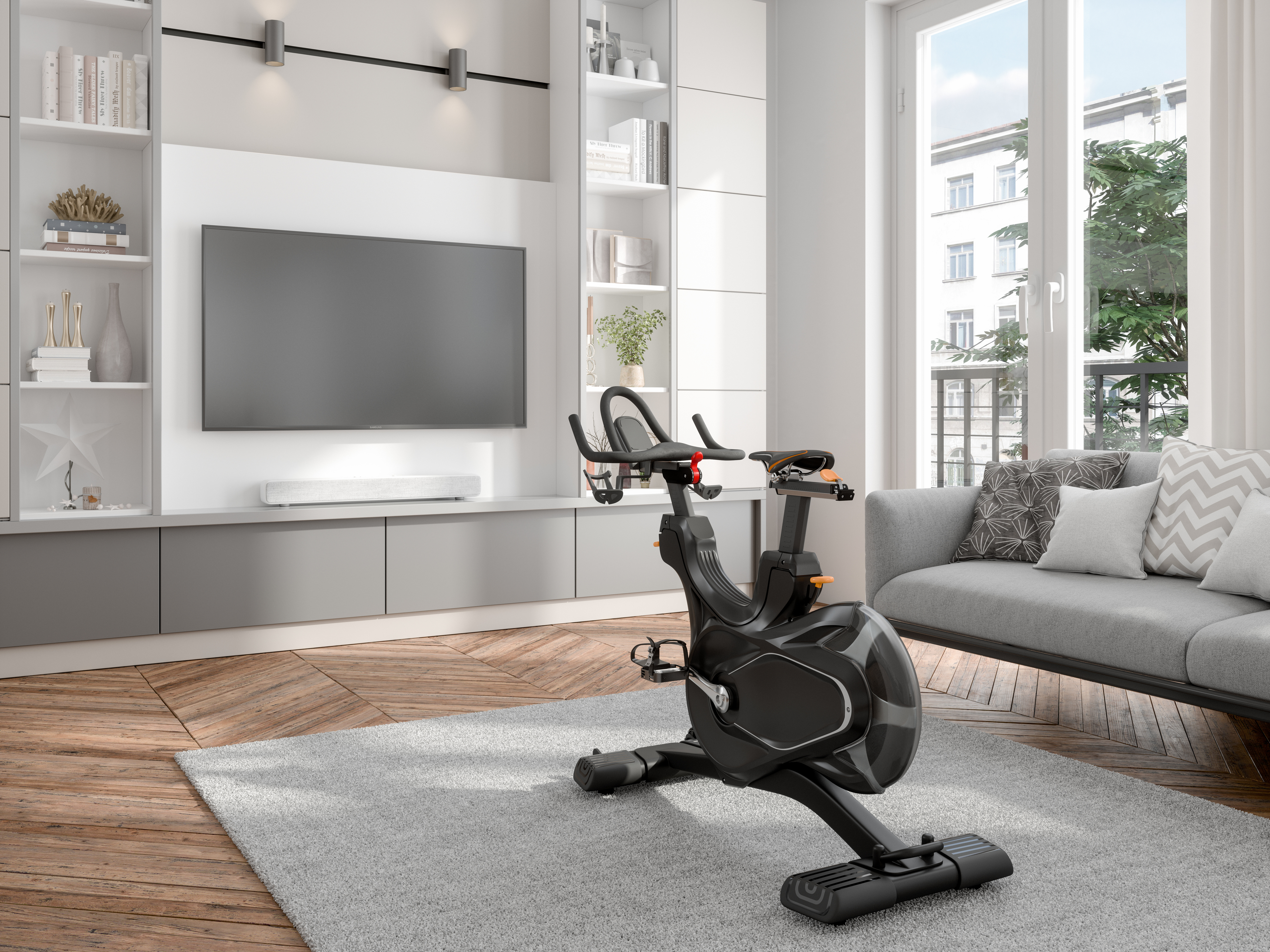 Exercise bike in a living room with a TV and bookshelves