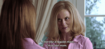 Amy Poehler in character as Mrs. George wearing a pink top with a necklace, caption says "I'm not like a regular mom. I'm a cool mom"