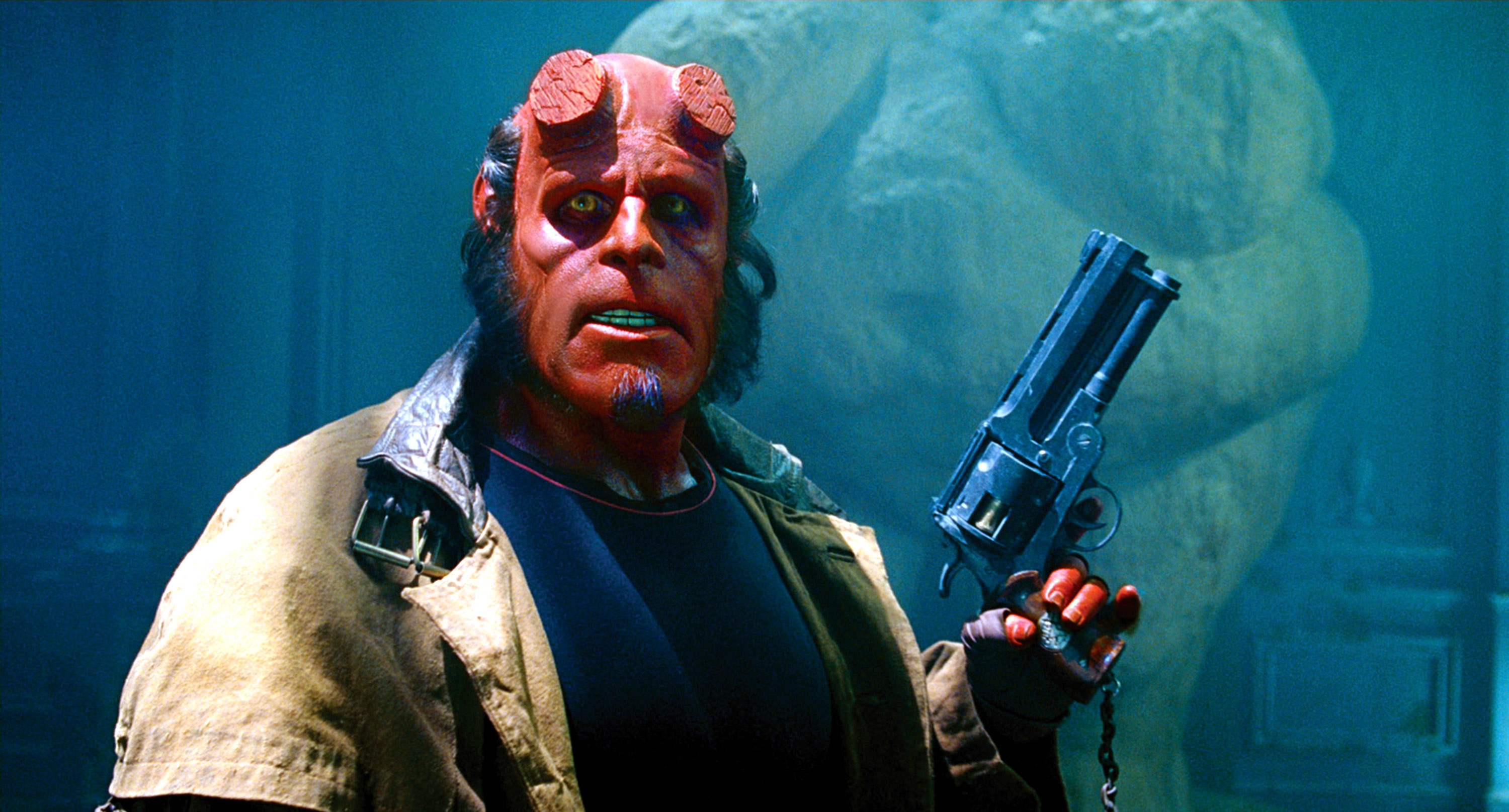 Character Hellboy holding a large gun, standing in a dimly lit, smoky room