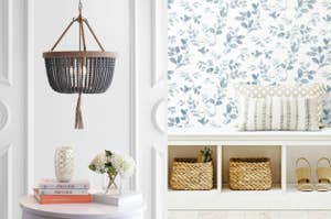 Four interior decor items: a hanging light, patterned wallpaper, a shelf with books, and storage baskets