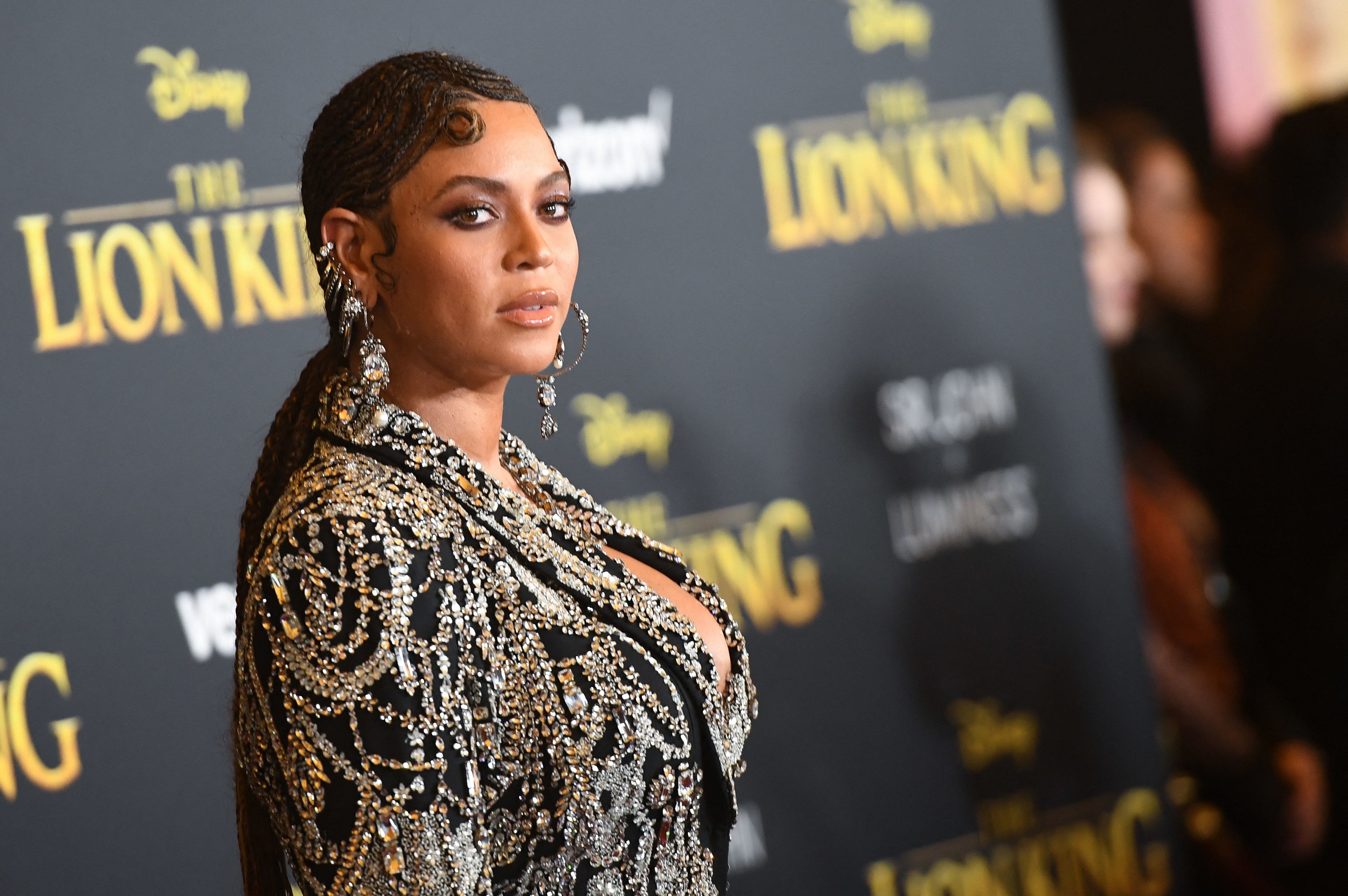 Beyoncé in a beaded gown with long braided hair at &quot;The Lion King&quot; premiere