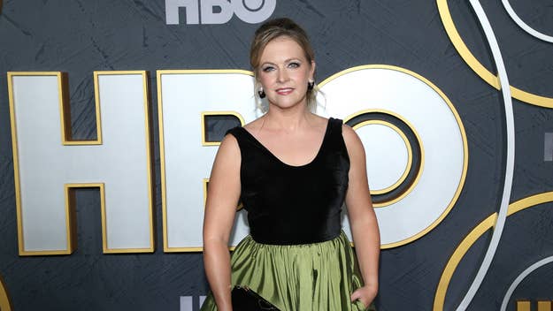 Amy Adams in a black velvet top and green skirt at an HBO event