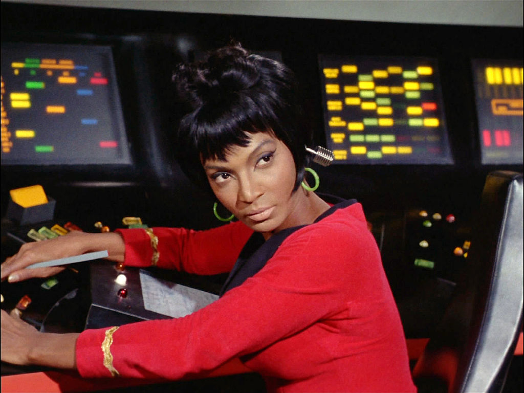 Uhura from Star Trek at her communications console on the Enterprise bridge