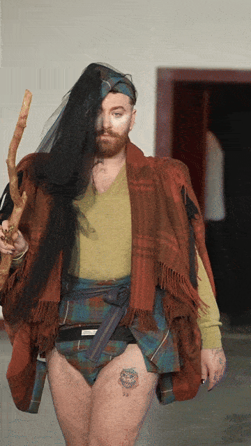 GIF of Sam Smith on the catwalk
