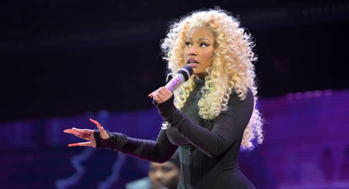 Nicki Minaj performing on stage with a microphone