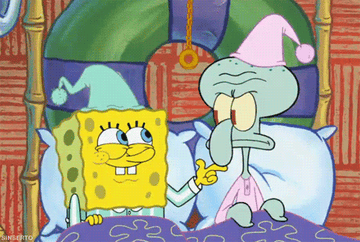 SpongeBob in a wizard costume and Squidward in bed, looking annoyed under a pink hat, from the SpongeBob SquarePants show