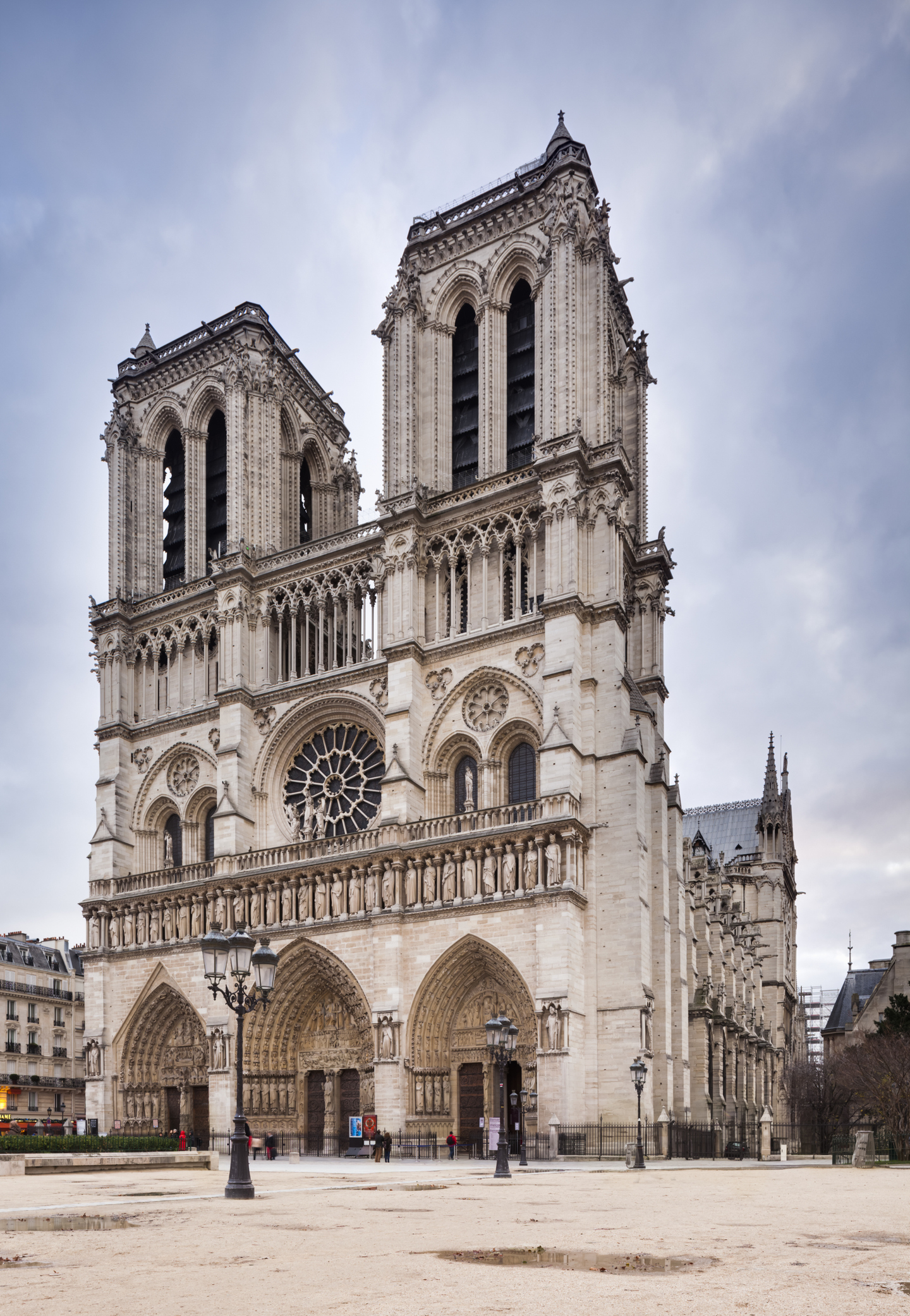 Notre-Dame Cathedral in Paris, showing its iconic twin towers and the large rose window, with a clear view of the facade