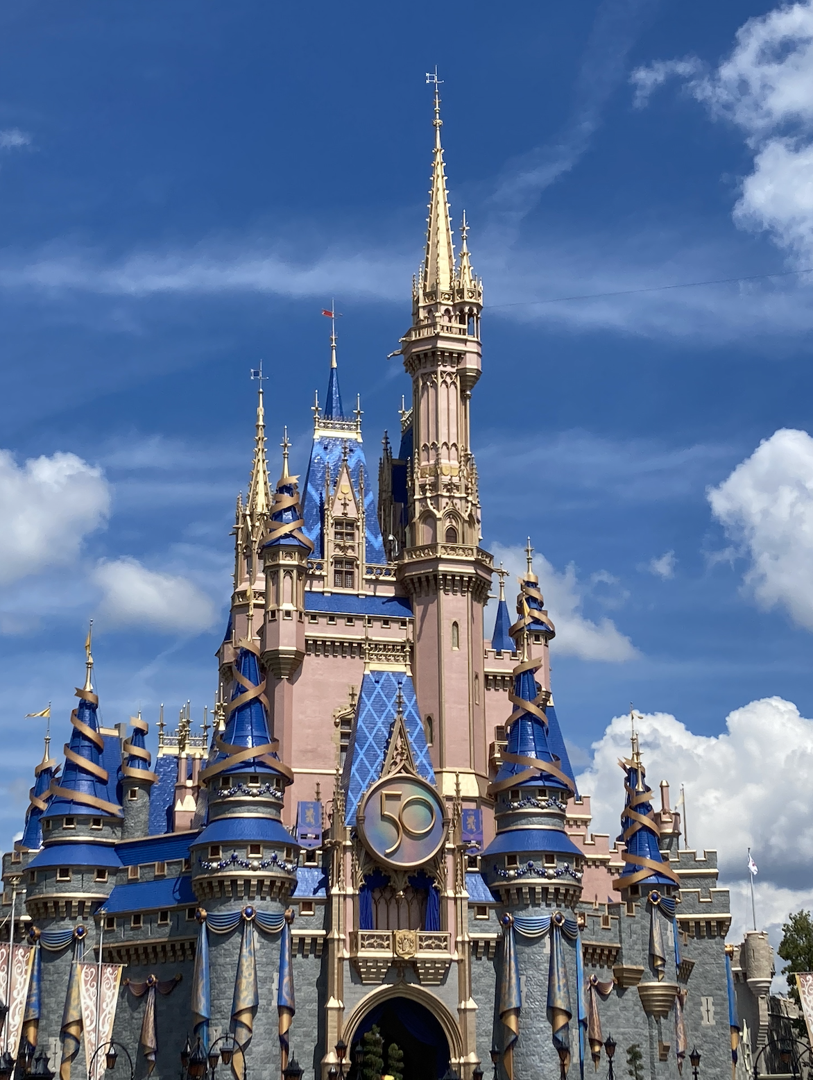 Disney&#x27;s Cinderella Castle adorned with a &quot;50&quot; emblem for the anniversary celebration