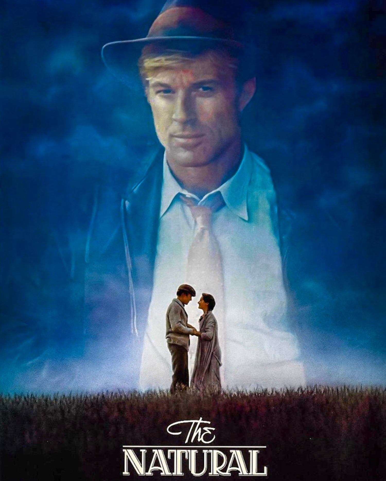 Movie poster of &quot;The Natural&quot; featuring Robert Redford as Roy Hobbs in a suit and hat with a ghostly couple below