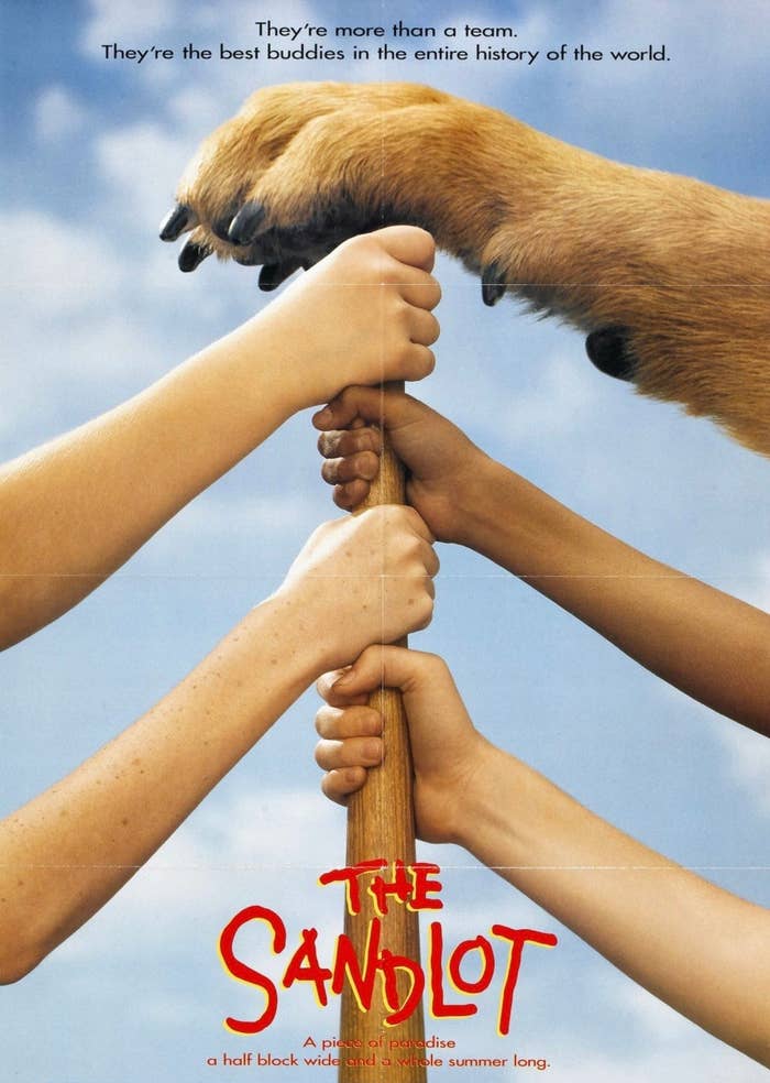 Movie poster of &#x27;The Sandlot&#x27; featuring hands clutched around a baseball bat against a sky backdrop