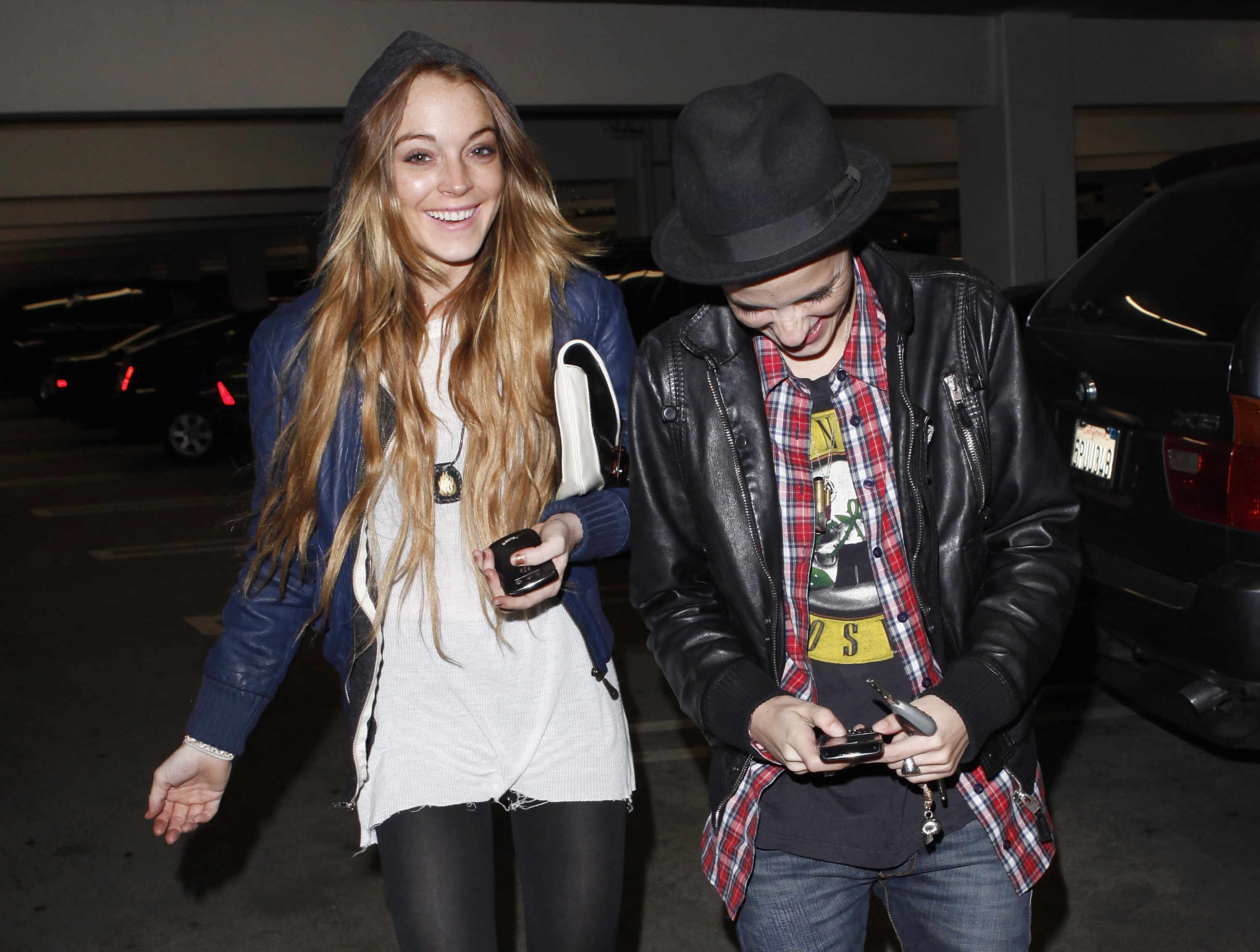 Lindsay Lohan and Samantha Ronson walking and laughing together