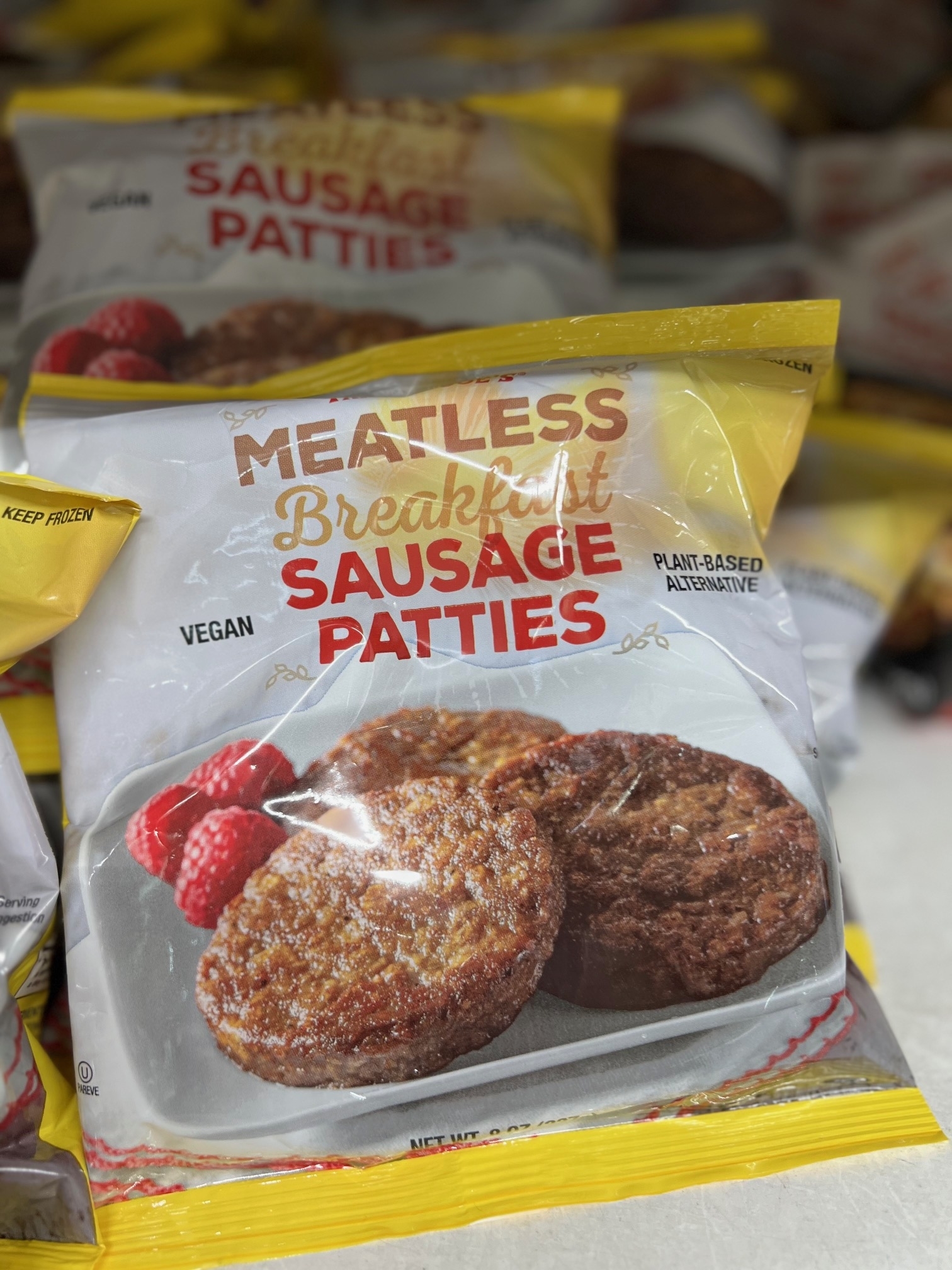 Package of Meatless Breakfast Sausage Patties on a store shelf, marked as vegan and plant-based