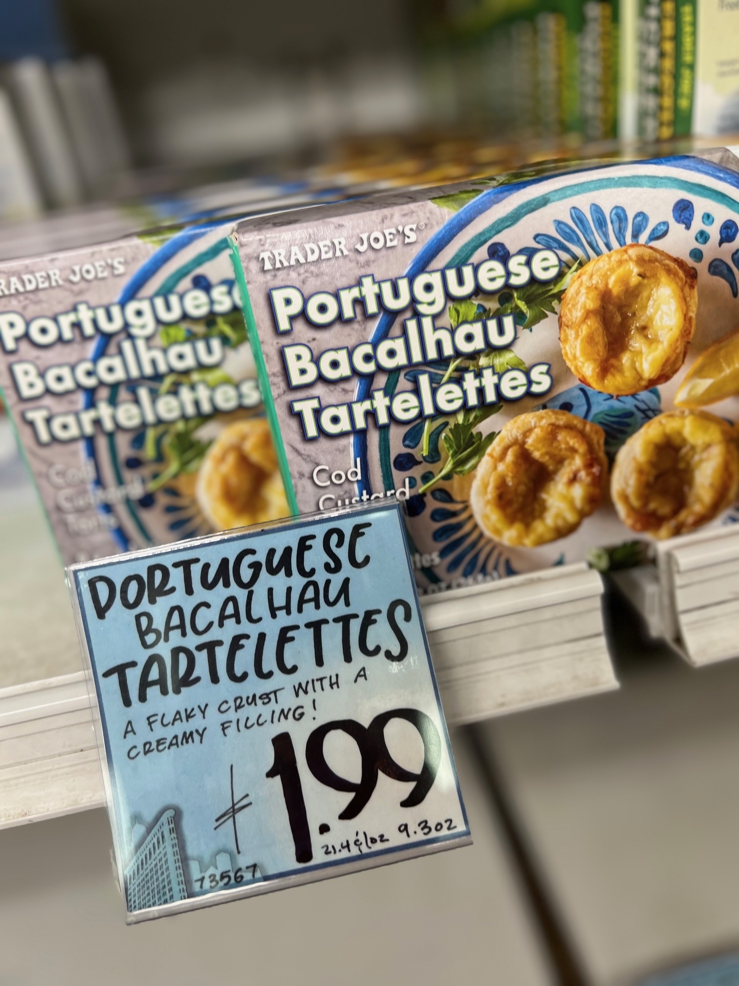 Trader Joe&#x27;s Portuguese Bacalhau Tartelettes boxes on shelf, price tag displays $1.99
