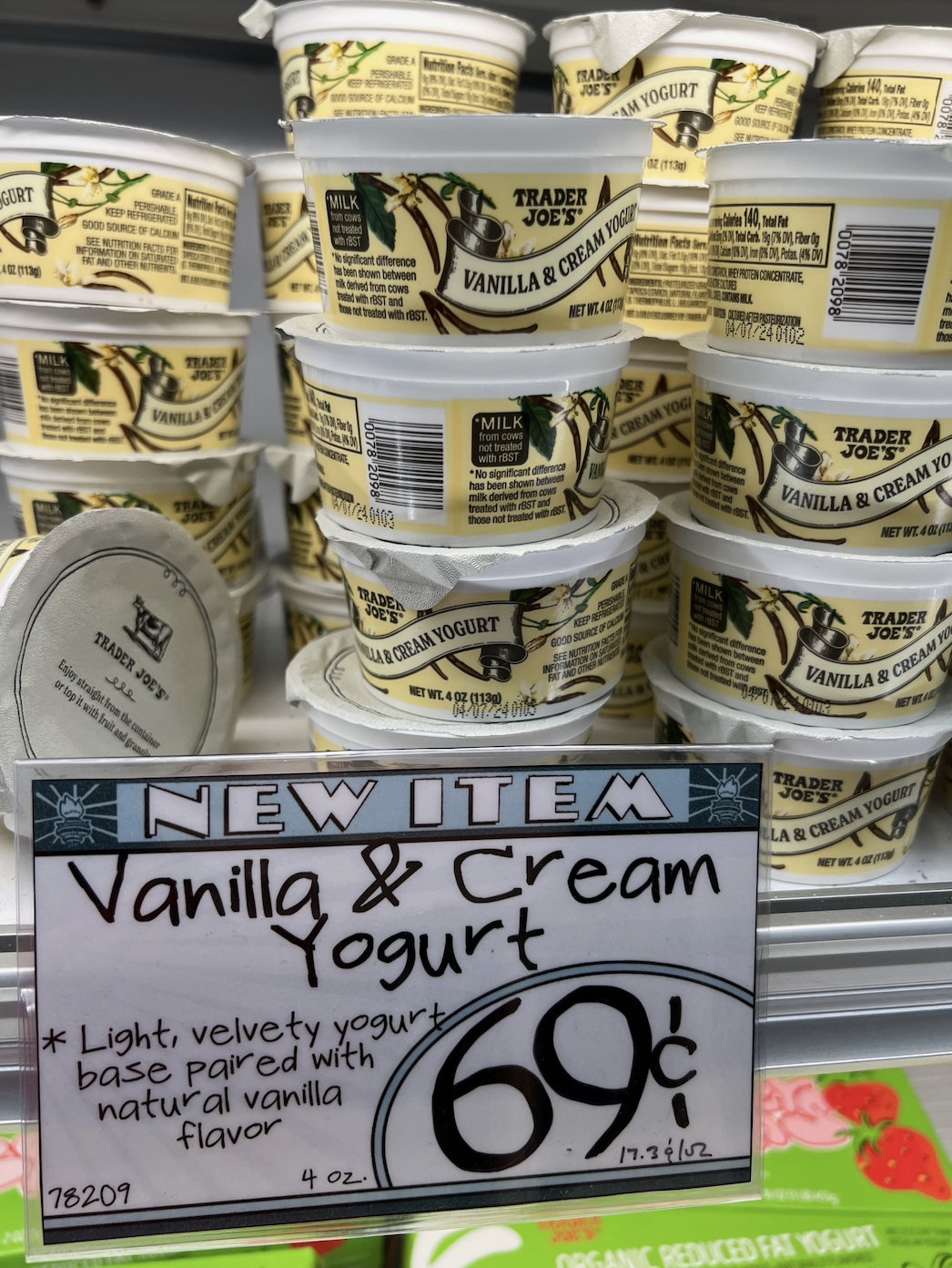 Shelves stocked with Vanilla &amp;amp; Cream Yogurt cups at Trader Joe&#x27;s, price tag displays 69 cents each