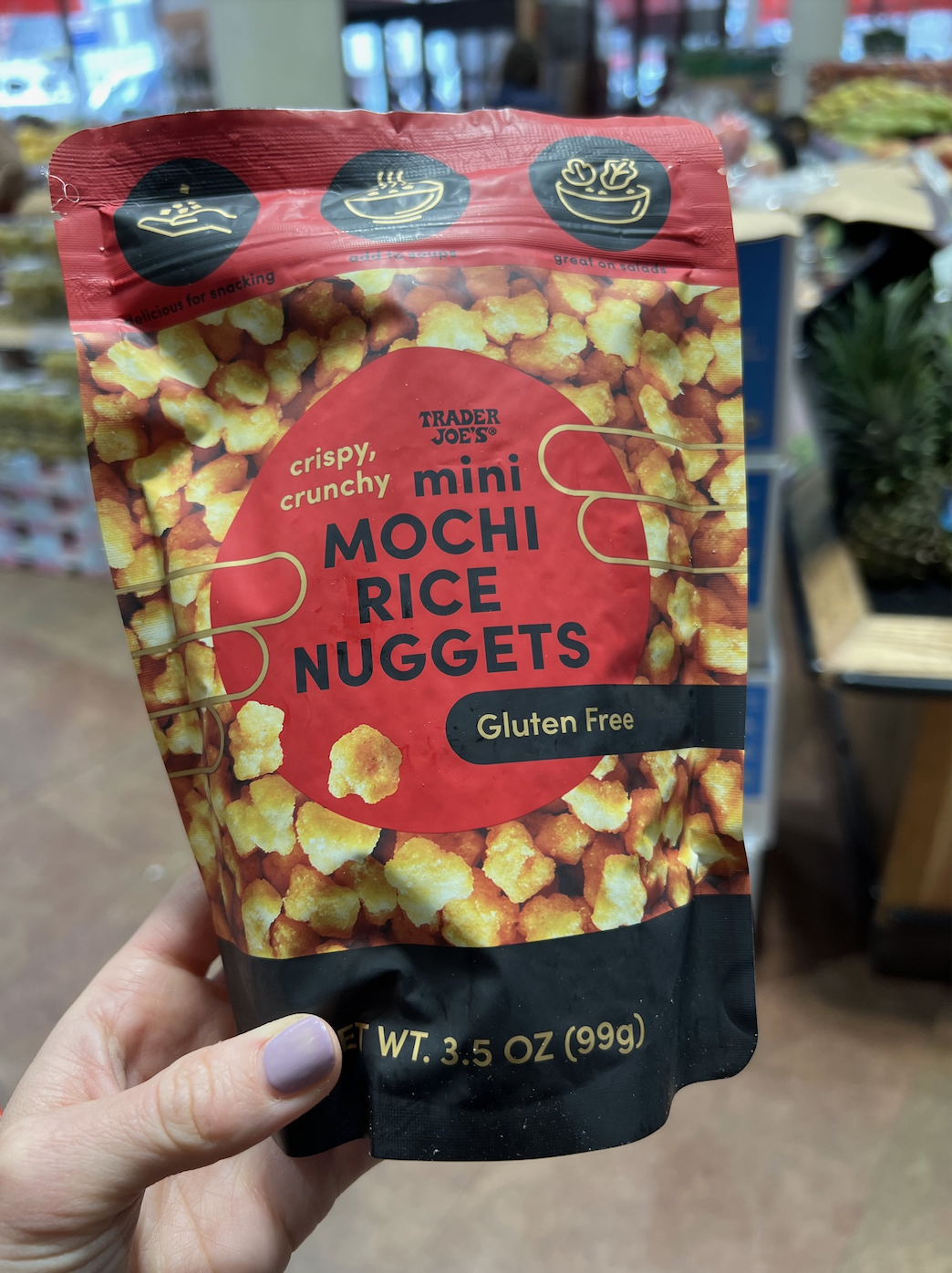 Hand holding a packet of Trader Joe&#x27;s Mini Mochi Rice Nuggets, gluten-free