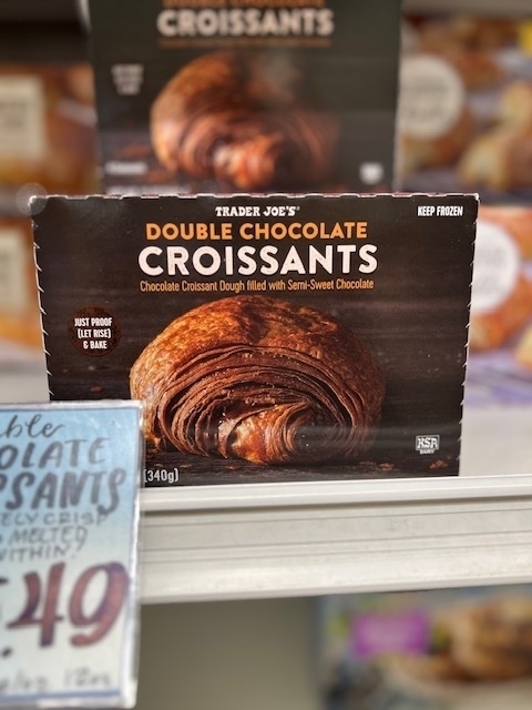 Package of Trader Joe&#x27;s Double Chocolate Croissants on a store shelf with price tag visible