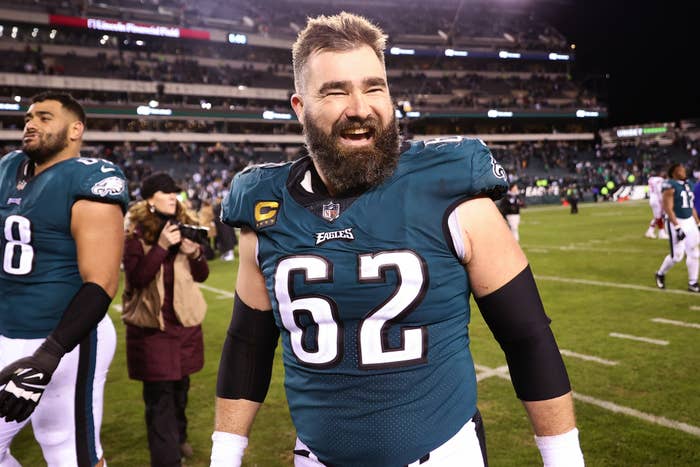 Jason Kelce on the field in Eagles jersey #62, smiling after a game