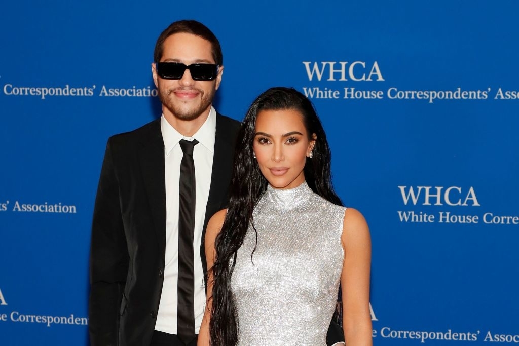 Pete and Kim posing at the White House Correspondents&#x27; Association event, one in a sparkling sleeveless dress and the other in a suit with sunglasses
