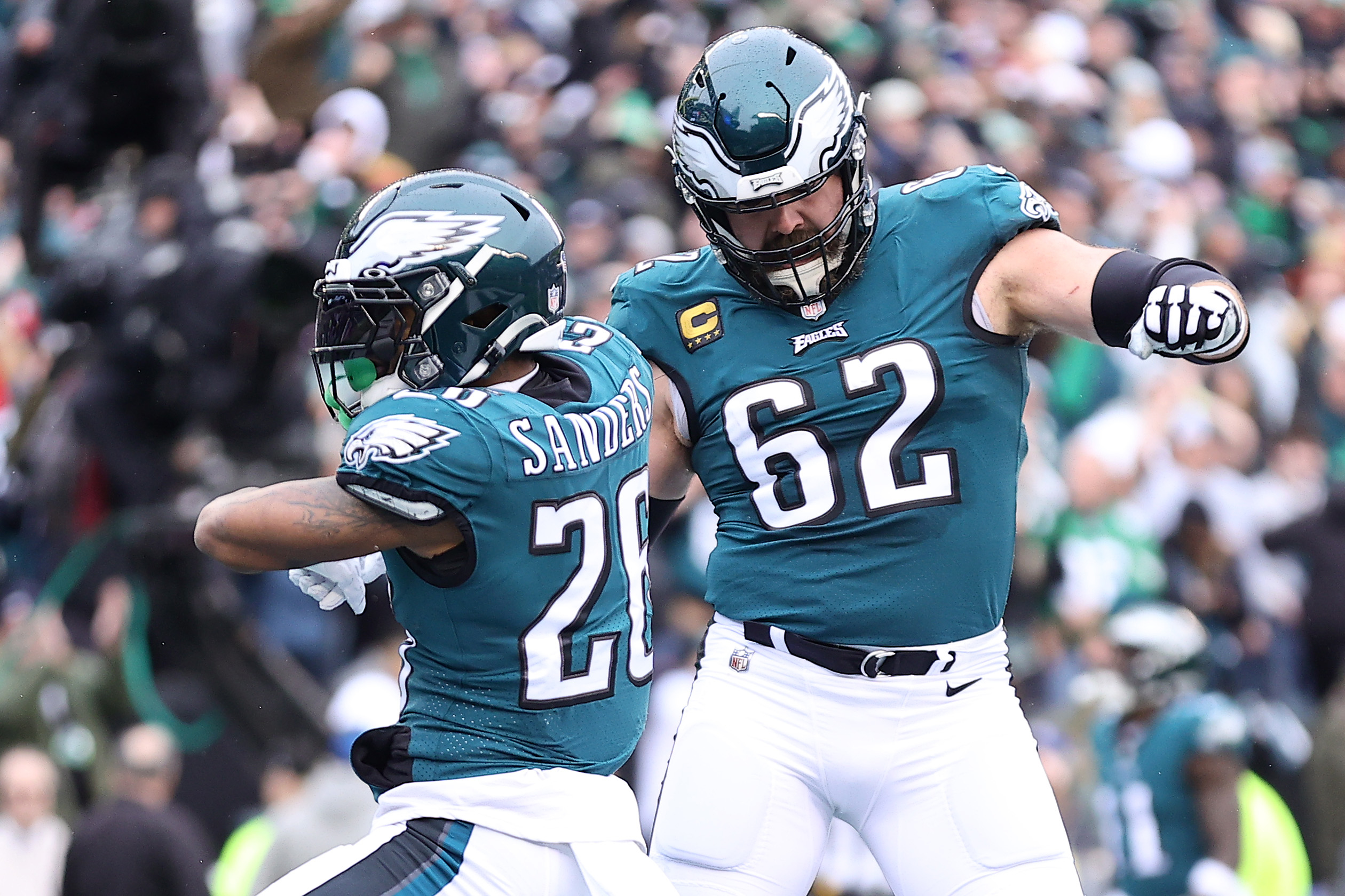 Two Philadelphia Eagles football players celebrating on the field